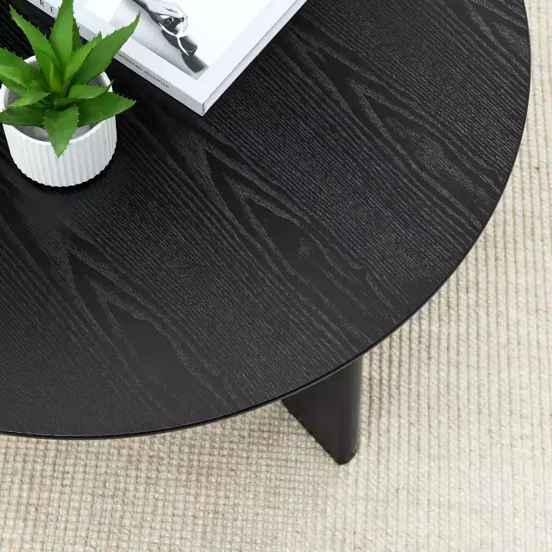 Mesa de centro redonda moderna de madera con patas cruzadas